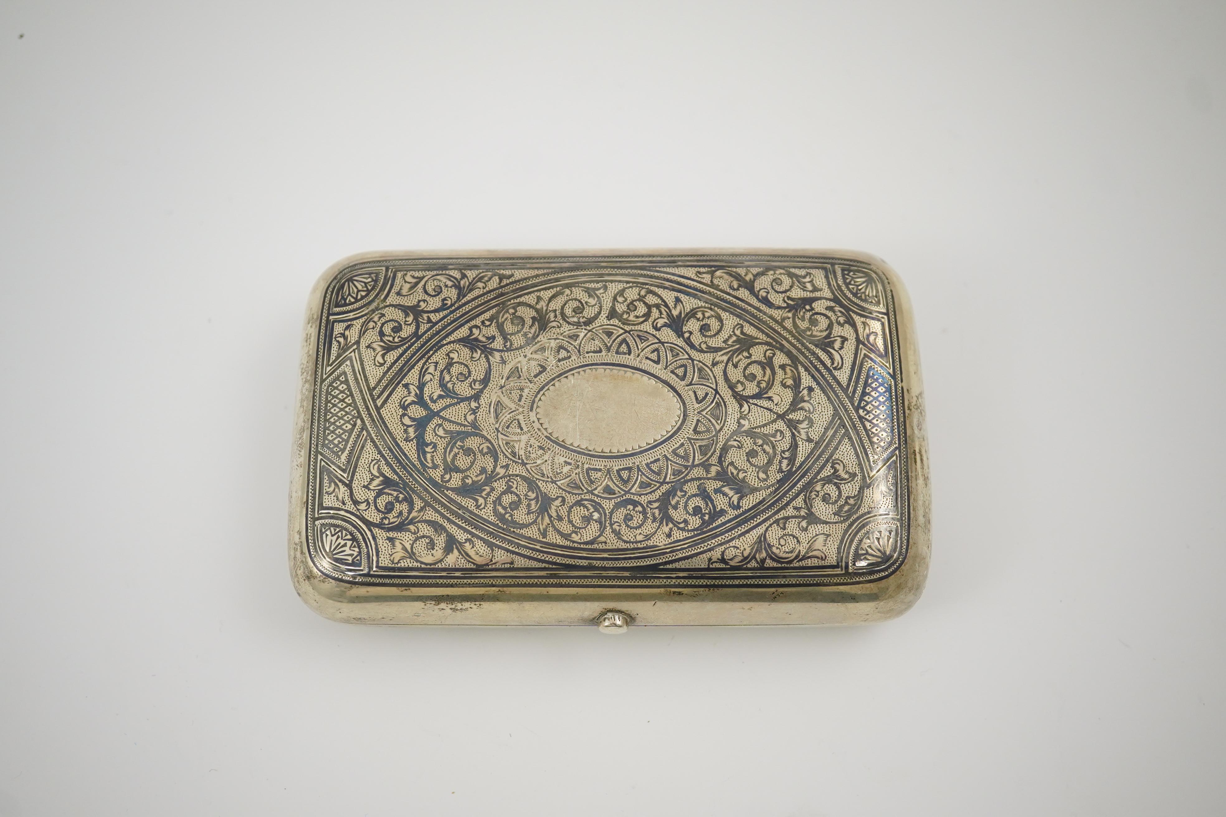 A late 19th century Russian 84 zolotnik and niello cigarette case, assay master A. Romanov, master Ivan F. Smirnov?